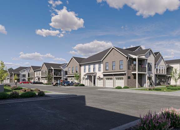 Modern townhome style apartment buildings with garages at Wildwood Lakeville Apartments, Lakeville, 55044