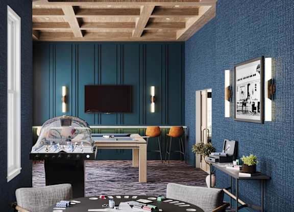 Game room with foosball table and lounge seating at Wildwood Lakeville Apartments, Minnesota, 55044