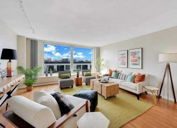 a living room with furniture and a large window