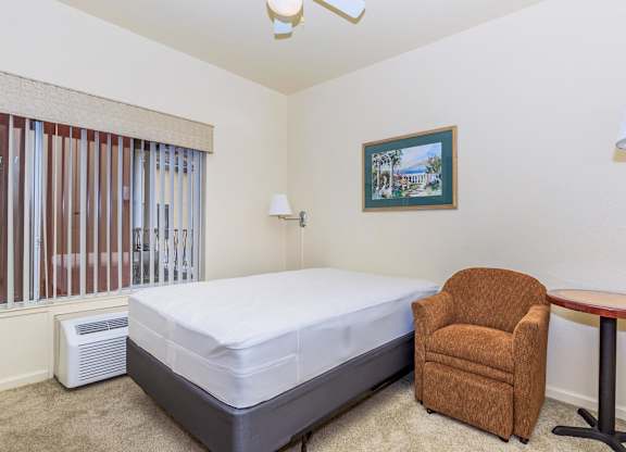 A Bedroom With a Painting On The Wall at Atrium Garden Apartment Homes, LLC, San Jose