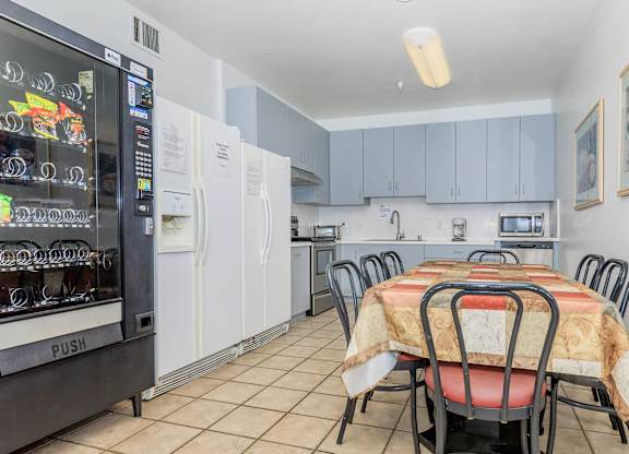 A Kitchen With a Table And Chairs at Atrium Garden Apartment Homes, LLC, San Jose