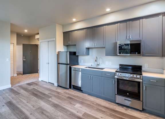 Modern kitchen with stainless steel appliances at 888 Fourth Street Apartments, LLC, Santa Rosa, CA, 95404