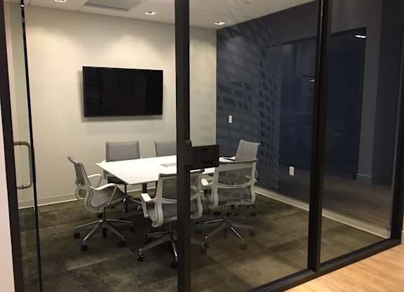 A conference room with a white table and chairs at Catalyst Mountain View, Mountain View