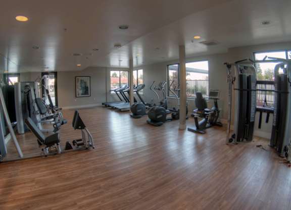 A spacious gym with a variety of equipment at Catalyst Mountain View, Mountain View, CA