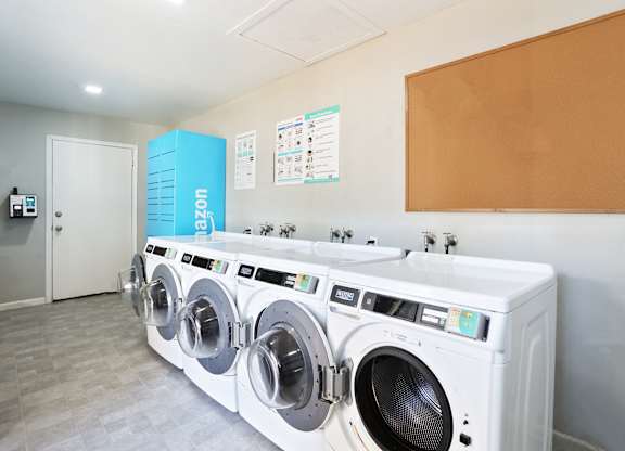 A row of washing machines in a laundromat.