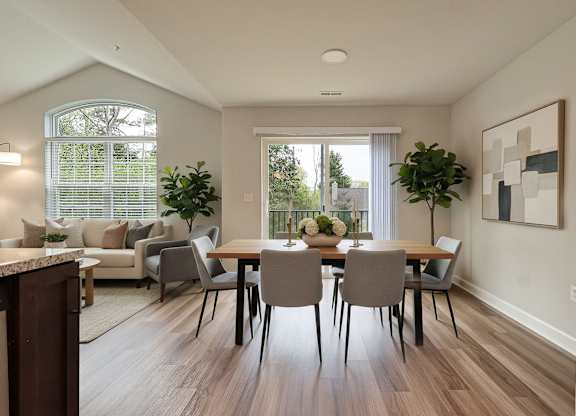 A dining room with a table set for four.
