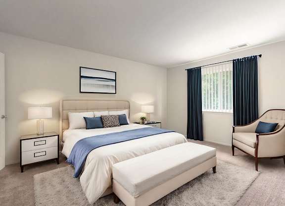 a bedroom with a bed and a chair