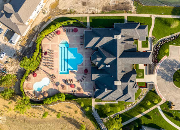an aerial view of an urban cityscape with a pool of water