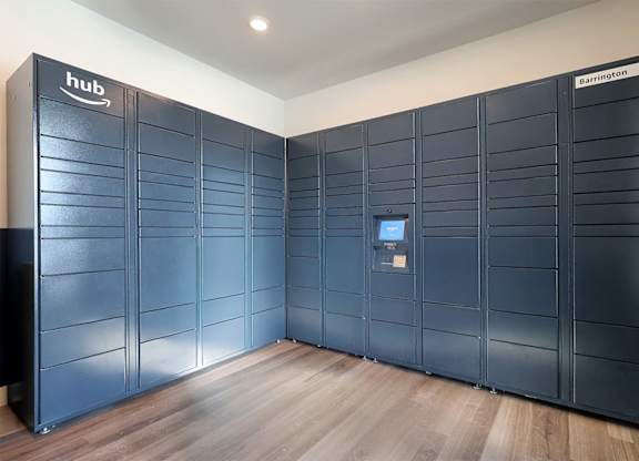 A row of Amazon Web Services storage units are lined up in a room.