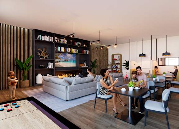 A group of people are gathered in a modern living room.
