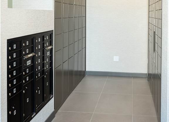 A hallway lined with mailboxes.