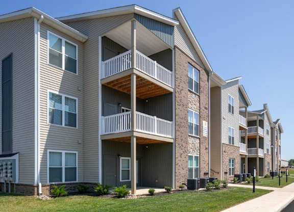 Apartment building with a clear blue sky in the background.
