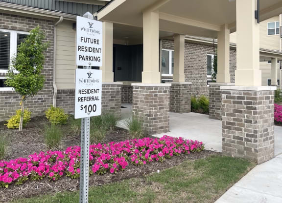 a house with a parking sign in front of it
