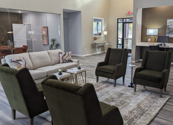 a living room with couches chairs and a rug