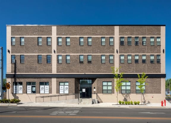 a large brick building on the side of a street