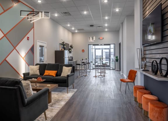 a living room with couches and chairs and a dining room table