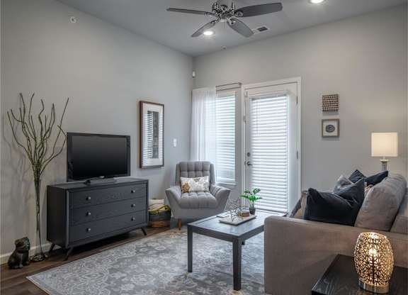 a living room with a couch and a tv