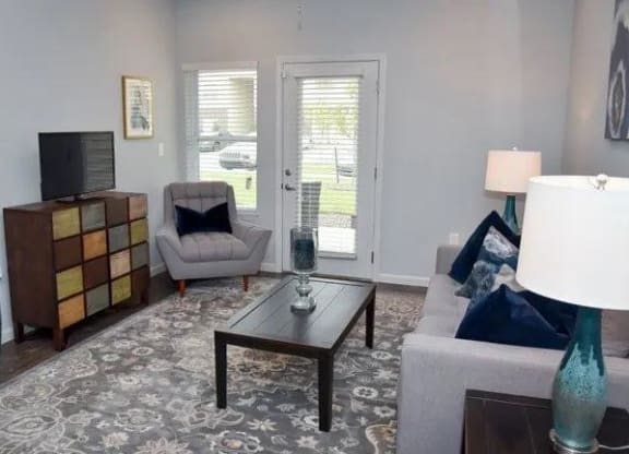 a living room with a couch a chair and a table