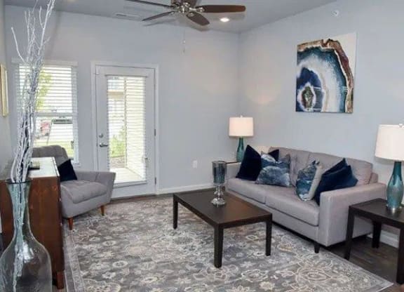 a living room with a couch and a table