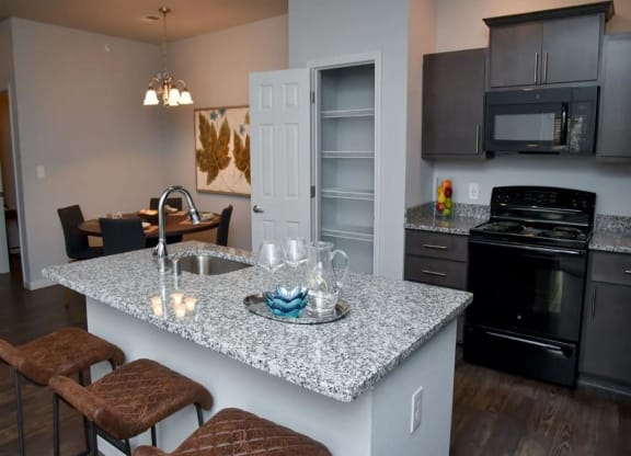 a kitchen with a granite counter top