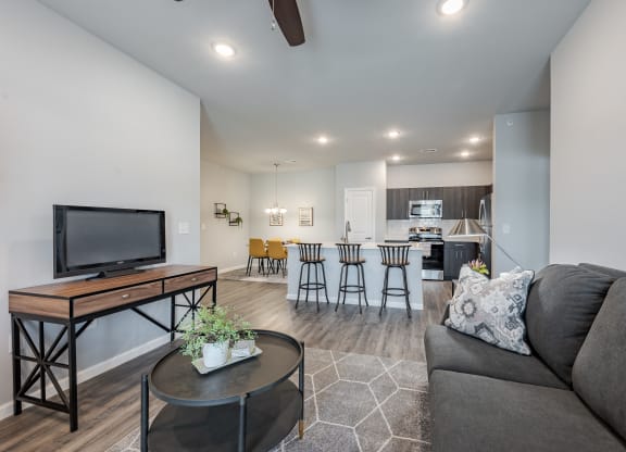 a living room with a couch and a table with a tv