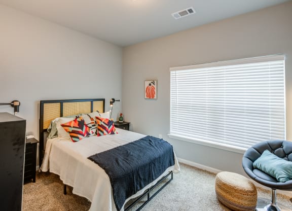 bedrooms with oversized windows at the preserve at great pond apartments in windsor tx