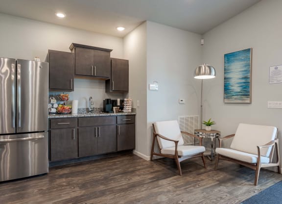 a kitchen with stainless steel appliances and a stainless steel refrigerator