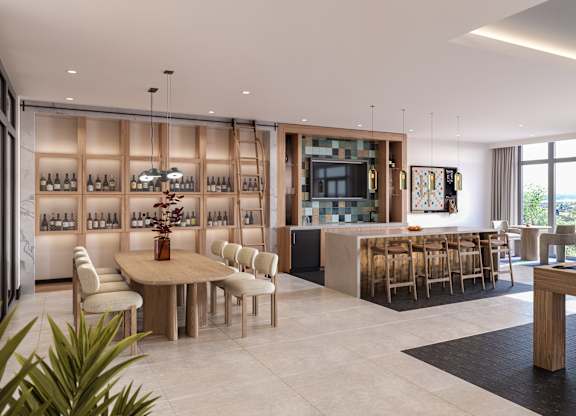 A modern living room with a pool table and a bar area.