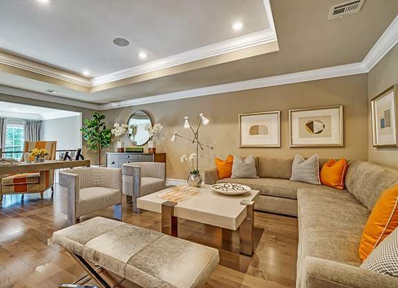 A living room with a grey couch and a coffee table.