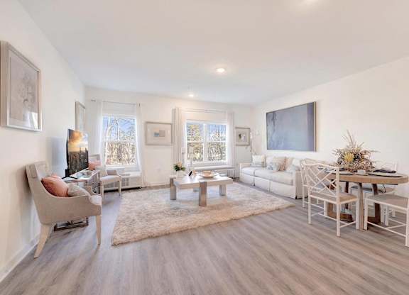 a living room with a couch and a table at The Franklin at Hillsborough Apartments, New Jersey