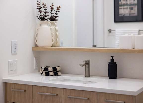 a bathroom with a sink and a mirror