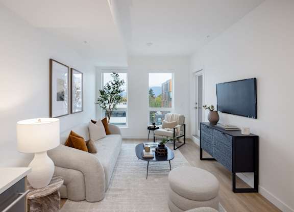 a living room with a couch and a tv