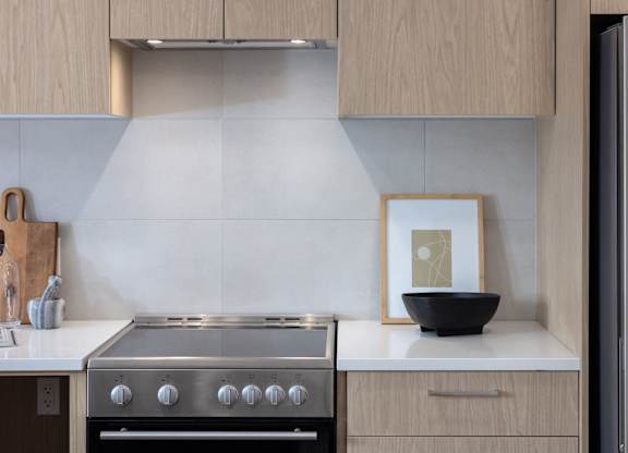 a kitchen with a stove and a bowl on the counter