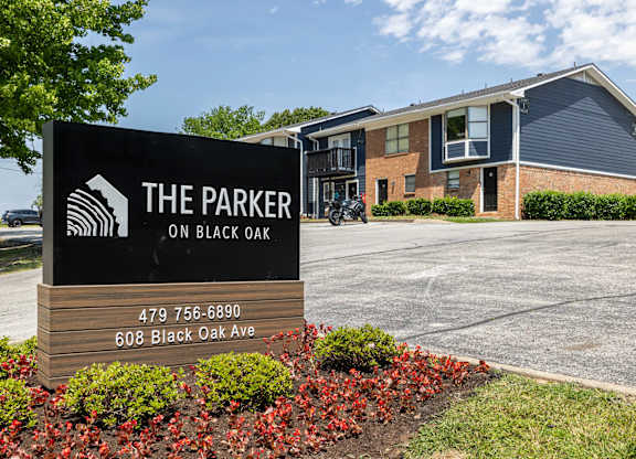 The Parker on Black Oak sign in front of a building.