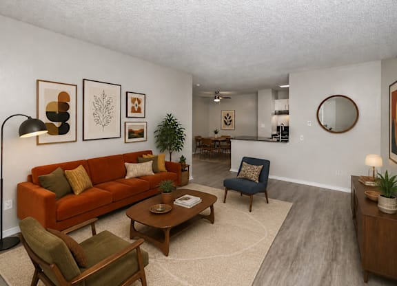 A living room with a couch, chair, and a table.