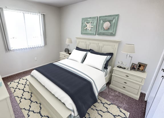 a bedroom with a bed and two paintings on the wall