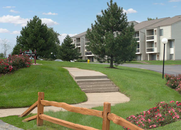 A building with a brown fence in front of it.