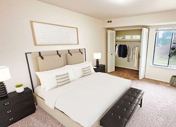 A bedroom with a large bed and a window.