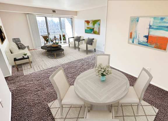 A white dining table with chairs and a vase of flowers is in a room with a painting on the wall.