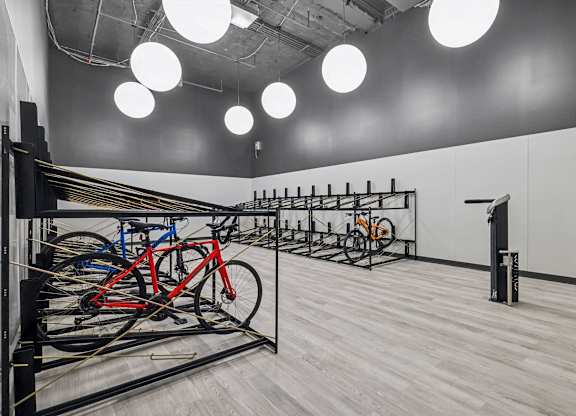 A room with a bicycle parking area and a white wall at LiveWell Apartments, Pennsylvania
