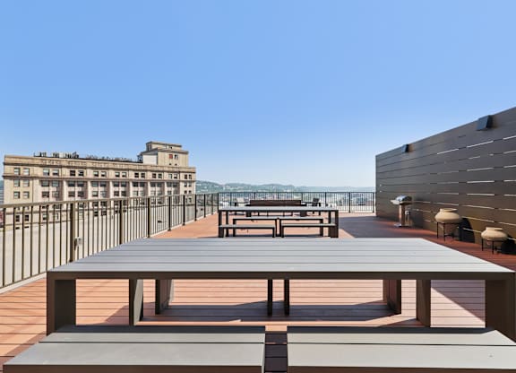 A long wooden table is in the middle of a patio at LiveWell Apartments, Pennsylvania