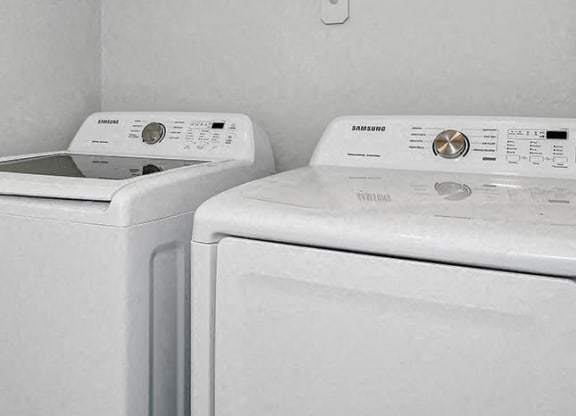 two white washing machines in a white laundry room at Baseline on 16, Arizona