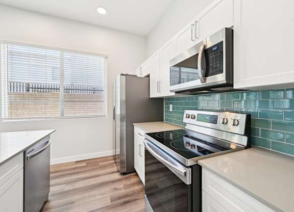 Townhome kitchen with stainless steel appliances