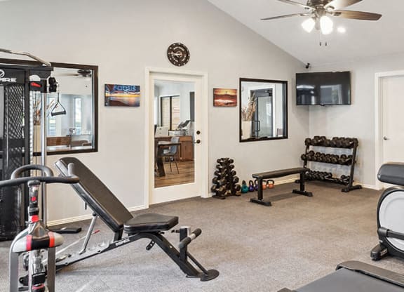 a gym with a ceiling fan and exercise equipment at Bella Vista, St. George, UT, 84790