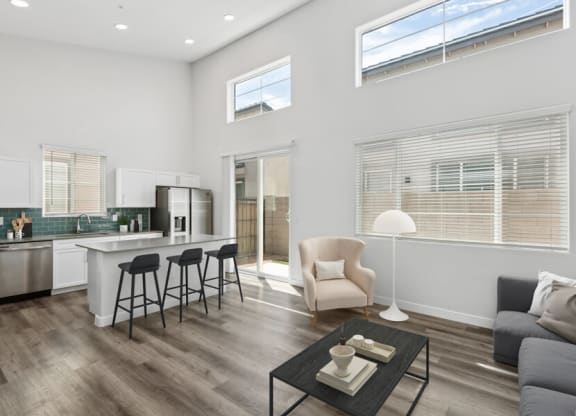 a living room with a kitchen and a couch and a table at Baseline on 16, Phoenix, Arizona