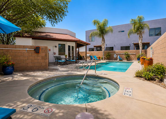 A pool with a waterfall and a sign that says 36 inches.