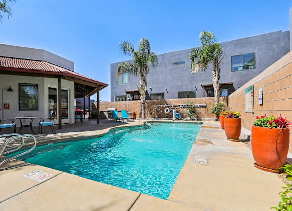 A pool with a red and white sign on the side of it.