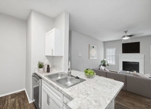 an open kitchen and living room with a sink at Heatherstone, Dallas