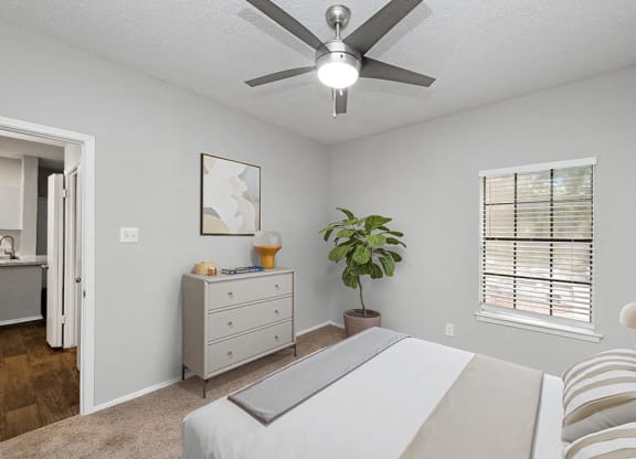 a bedroom with a bed and a ceiling fan at Heatherstone, Texas, 75287