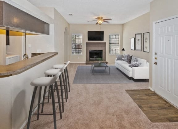 a living room with a bar and a couch at Heatherstone, Dallas, 75287